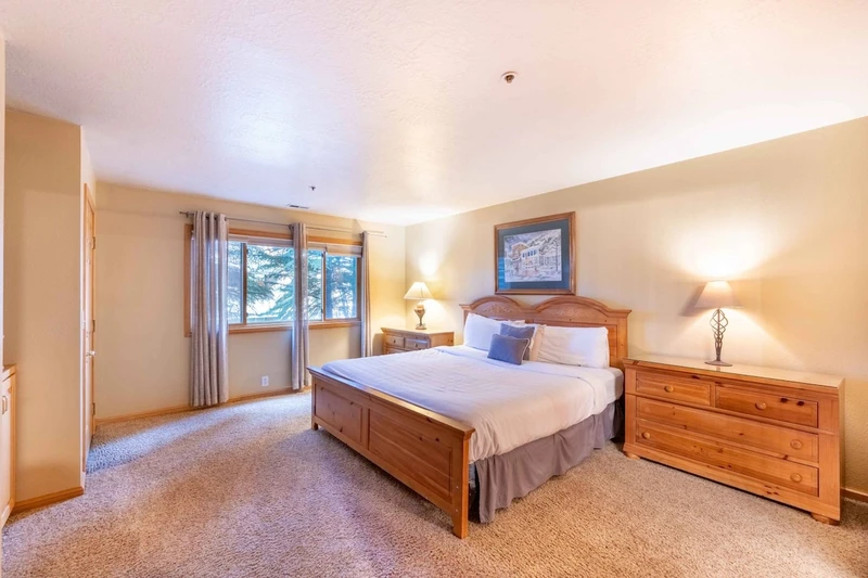 The Primary suite has a beautiful king bed & plush mattress, full sized dresser & large nightstands, new HDTV and en suite bathroom
