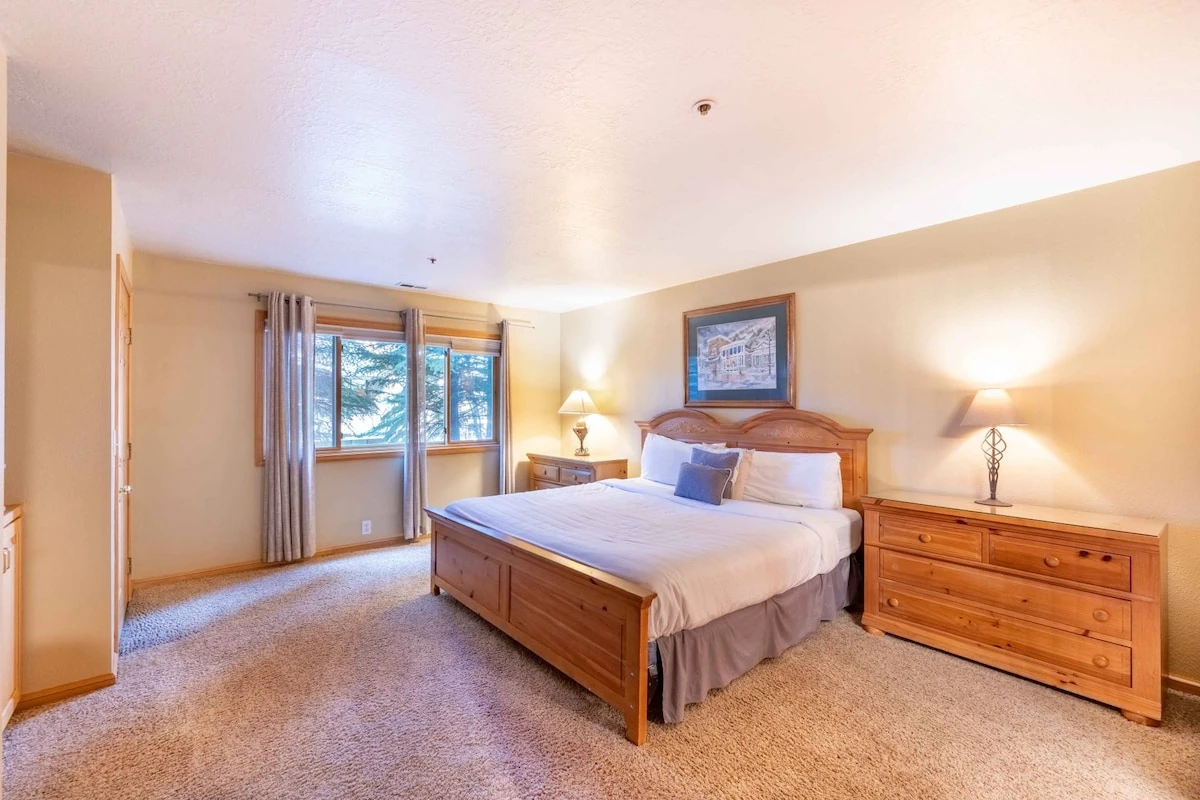 The Primary suite has a beautiful king bed & plush mattress, full sized dresser & large nightstands, new HDTV and en suite bathroom