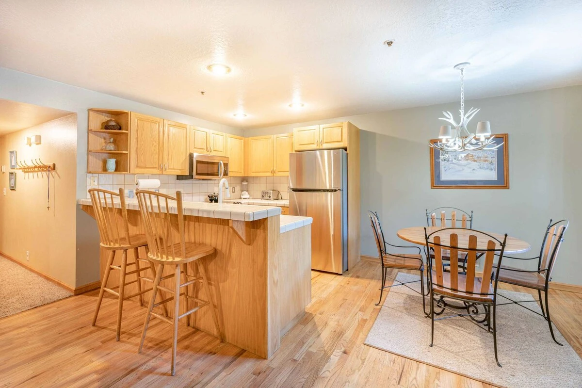 The newly updated open kitchen is ready to make wonderful meals at home! There is plenty of seating at both the dining table and the breakfast bar.