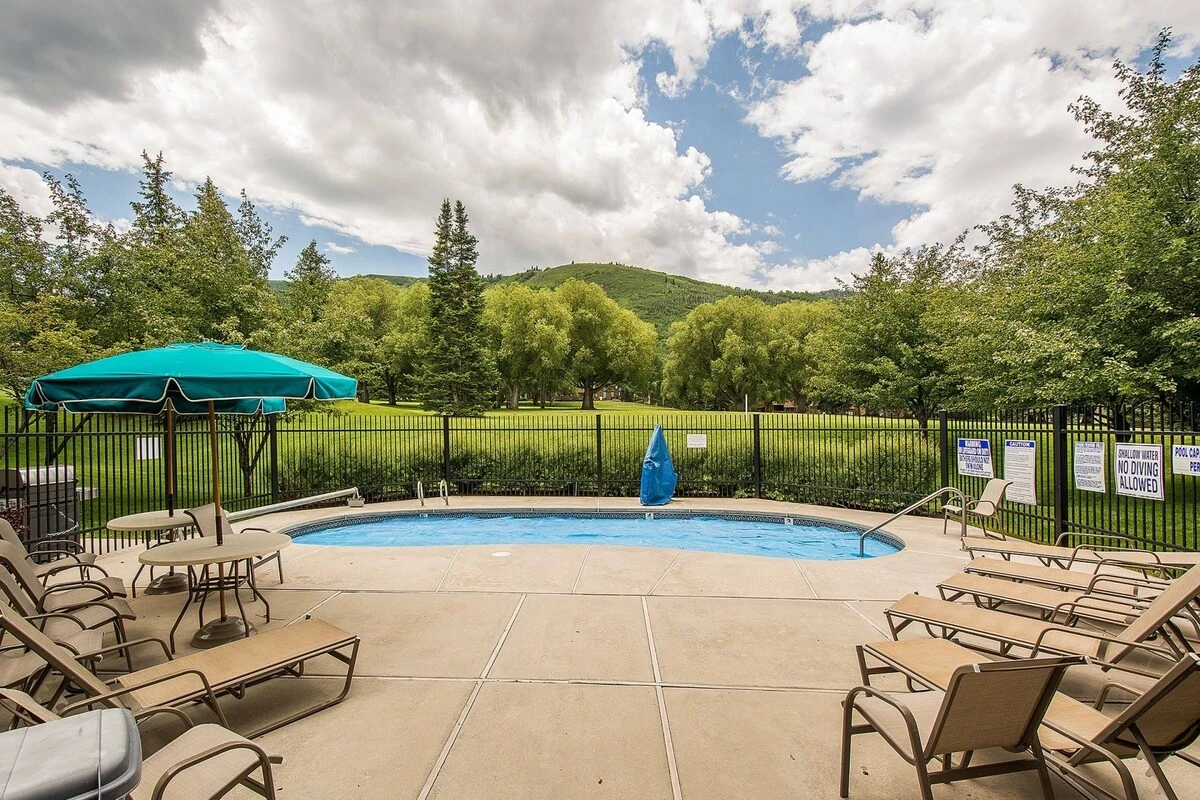 Take in this view from the front door of the home. Stunning views of the pool and Park City Golf Course