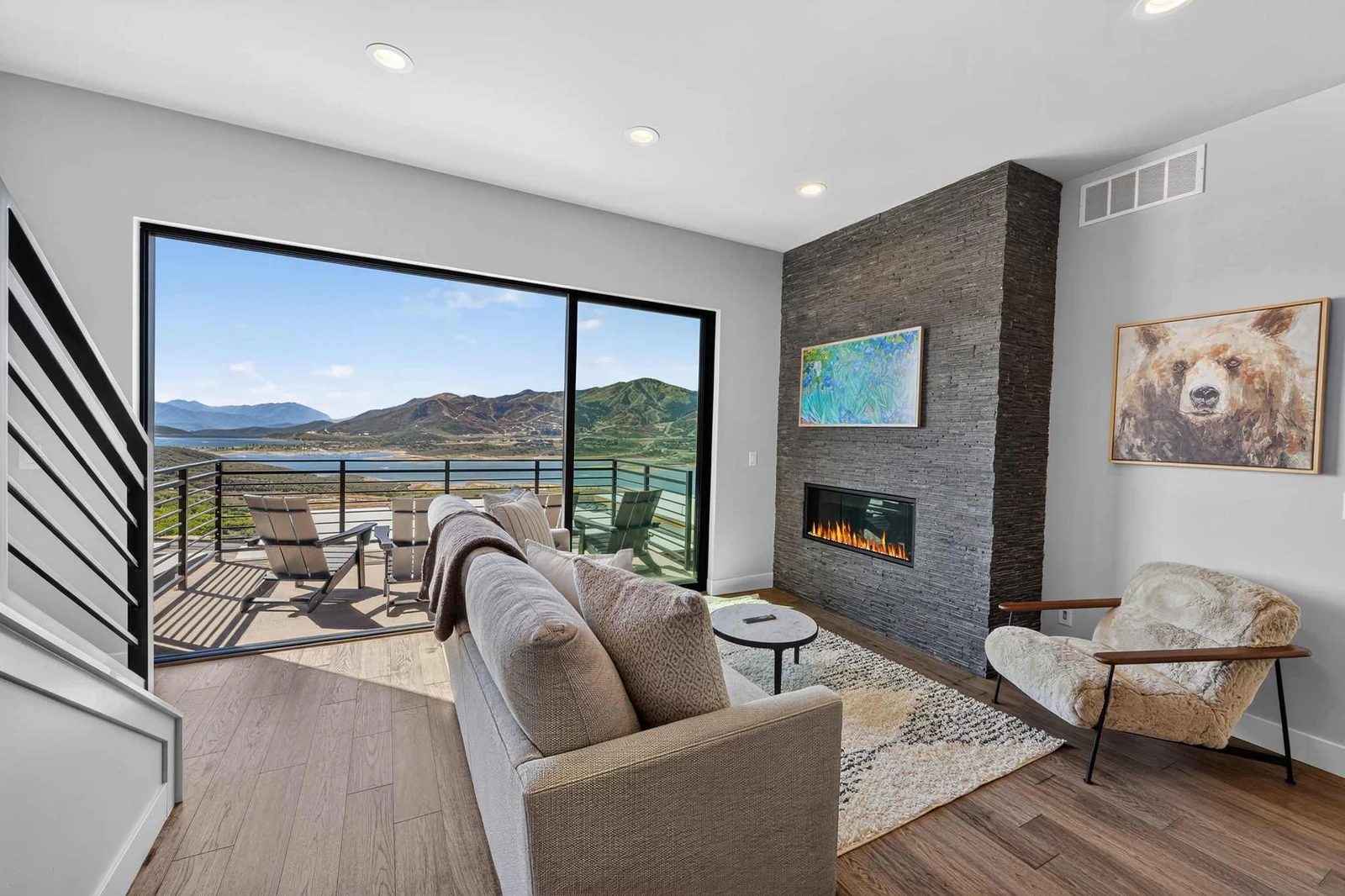 Sliding glass wall opens the living room directly onto the deck