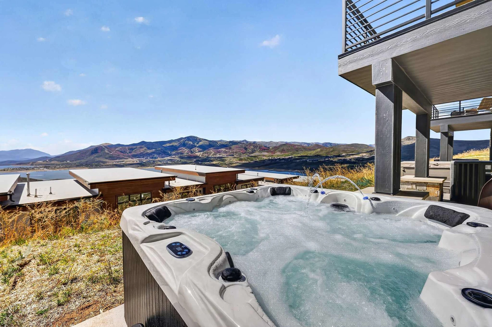 Private hot tub with lake and mountain views, seats 8